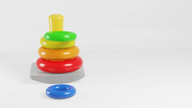 3D render of colorful stacking rings falling onto a pole on a white background