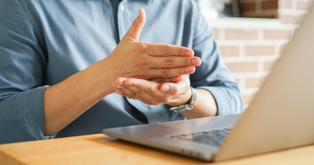 close up man hand gesture about stop sign language to teaching or learning from webinar in home for lifestyle concept
