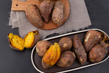 roasted sweet potatoes on a black background