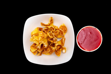 Overhead view of crab rangoons on a white plate with sweet and sour dipping sauce in a bowl. © john