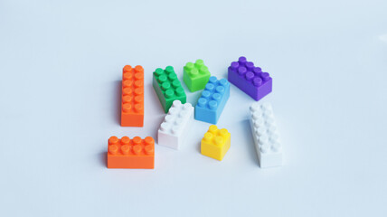 Building bricks or pastel building block or kids toy colorful plastic blocks isolated on white.
