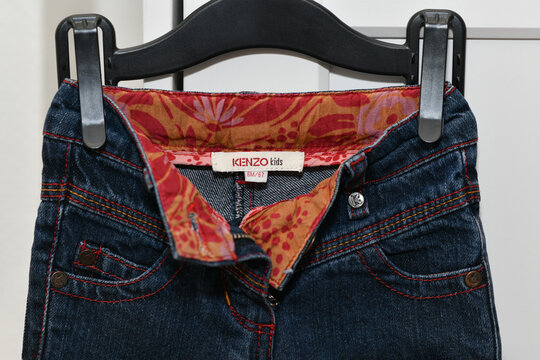 PARIS - FRANCE - 05 March 2023 - Kenzo label on jeans for kids. A luxury fashion brand