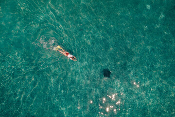 Tourists snorkeling in the waters off South Silk Cayes in the Gladden Spit and Silk Cayes Marine...