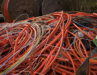 Plastic waste remnants of colorful fiber optic cables ready for recycling