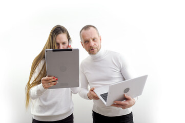 important Call on phone girl with tablet in hands talking focused and looking confident man...
