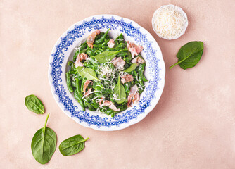  Gnocchi alla tirolese or Spaetzle (spätzle), fresh pasta an irregular shape. Recipe of spinach gnocchi with pancetta and creamy sauce sprinkled with grated Parmesan. Tirol, Trentino-Alto Adige, Italy