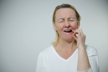 hispanic girl wearing casual clothes touching mouth with hand with painful expression because of toothache or dental illness on teeth. dentist toothache or dental illness on teeth