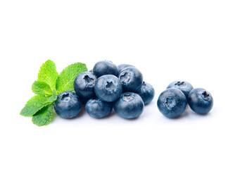 Blueberries with mint leaves on white backgrounds.