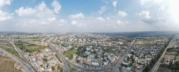 A 180-degree aerial panorama of urban development around Raiwind road in Lahore, city of Punjab Province in Pakistan.
