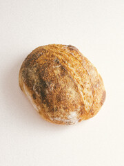 loaf of sourdough bread on white background