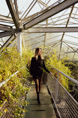 Young beautiful woman in botanical garden.