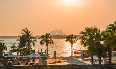 Fototapeta na wymiar Dubai, UAE. Atlantis at Palm Jumeirah and villas with white sand beaches at sunset