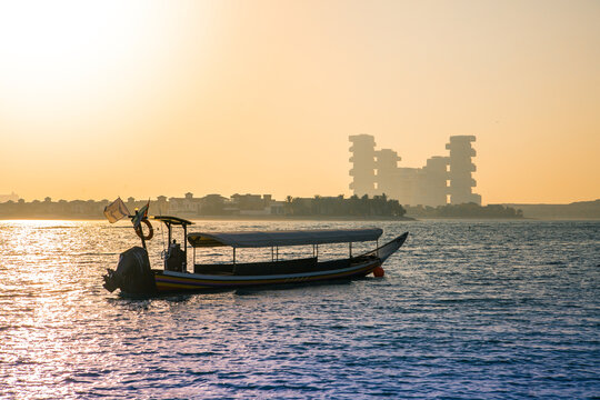 Dubai, UAE.  Atlantis at Palm Jumeirah and traditional boat at sunset