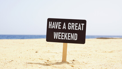Have a great weekend is shown using the text on the banner on the beach