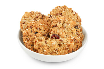 Granola cookie in ceramic bowl isolated on white background with full depth of field