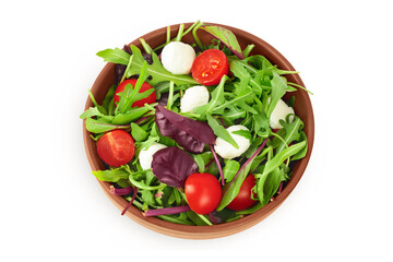 Mix salad - arugula, spinach, chard, cherry tomatoes and mozzarella in the bowl isolated on white background. Top view. Flat lay