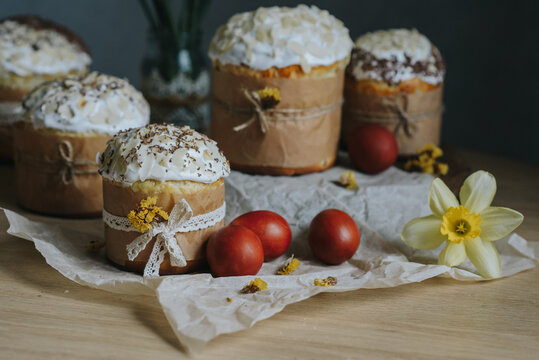 Traditional ukrainian easter cakes with painted eggs. Spring daffodil and colorful painted eggs. Homemade food on the table