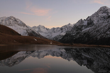 The beautiful Pontet Lake in the french Alps with view on La Meije mountain