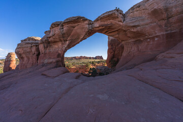 hiking the broken arch trail in arches national park, utah, usa