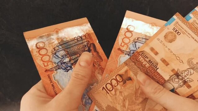banknotes of money in tenge currency are counted