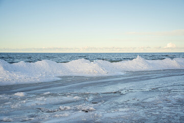 Fototapeta na wymiar Baltic Sea in Winter. Beautiful view of Ice and Snow along the coast.
