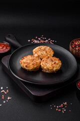 Delicious fresh cutlets or meatballs with spices, herbs and tomato sauce