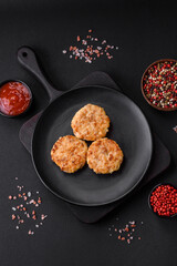Delicious fresh cutlets or meatballs with spices, herbs and tomato sauce