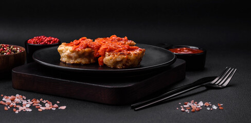 Delicious fresh cutlets or meatballs with spices, herbs and tomato sauce