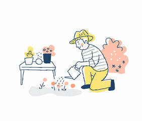 庭の植物に水を与えているシニア男性