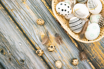 Easter eggs, decoration on wooden table. Celebrating Easter. View from above
