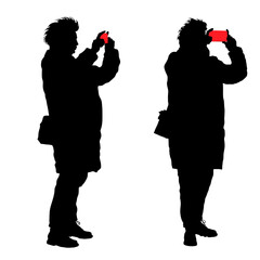 Vector silhouettes of a woman with a phone camera, 2 poses, sideways and three quarters. Girl in a down jacket, hair develops, winter clothes.