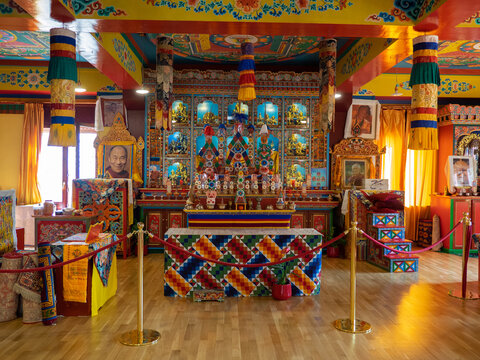 Panillo, Spain. February 27, 2022. Buddhist temple altar with offerings, symbols, Buddhas.
