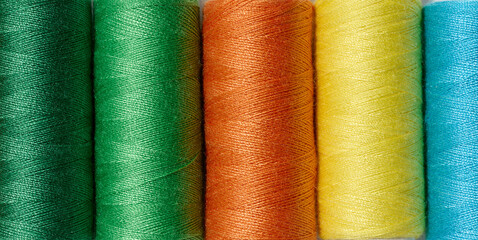 Multicolored spools of sewing threads