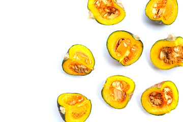 Green pumpkin pieces on white.