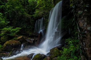 Fototapeta na wymiar Beautiful deep forest waterfall at Thailand.
