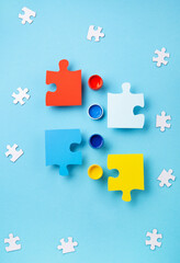 World Autism Awareness Day Card, colorful Puzzles on Blue Background.