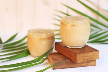Coffee with ice and milk. Composition with a summer invigorating drink. Focus in the foreground