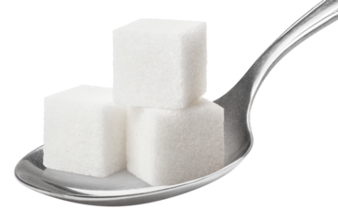 Sugar cubes in metal spoon cut out