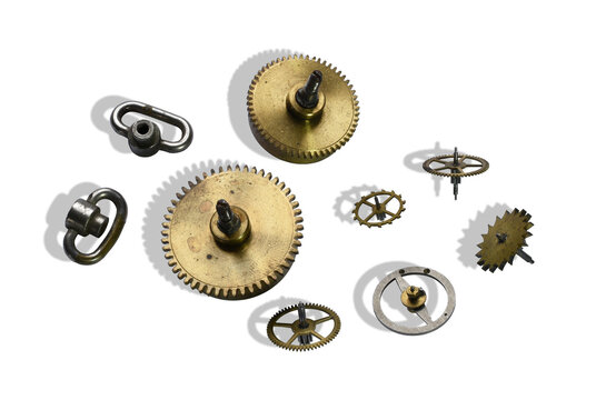 Gear wheels and other elements of clock mechanism isolated on the transparent background (with shadow)