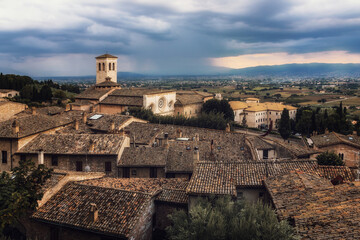 Evening panorama on the roofs of the historic center of Assisi and the Basilica of Saint Clare.