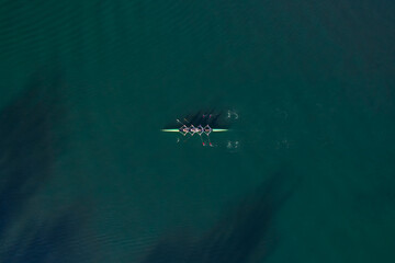 Row team boat from above