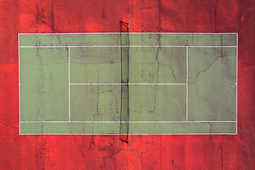 Red and green tennis court from an aerial view