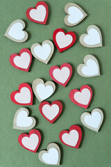 Obraz premium white and pink paper hearts on wood hearts some painted red
