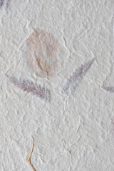 mulberry paper with flowers and leaves and other decorative matter - macro lens, particular focus