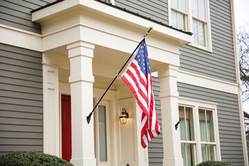 US flag depicting historic freedom and american pride along with independence of fourth of july and patriotism on a national level in the sky and home