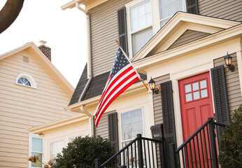 US flag depicting historic freedom and american pride along with independence of fourth of july and patriotism on a national level in the sky and home