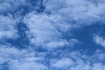 White clouds in a bright blue sky