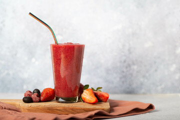 Mixed berry smoothie garnished with fresh fruit