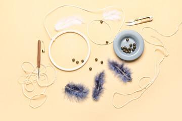 Materials for making dream catcher on beige background