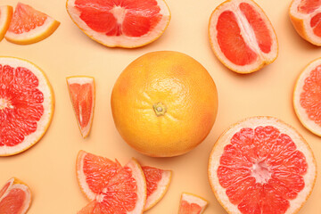 Composition with pieces of ripe grapefruit on color background